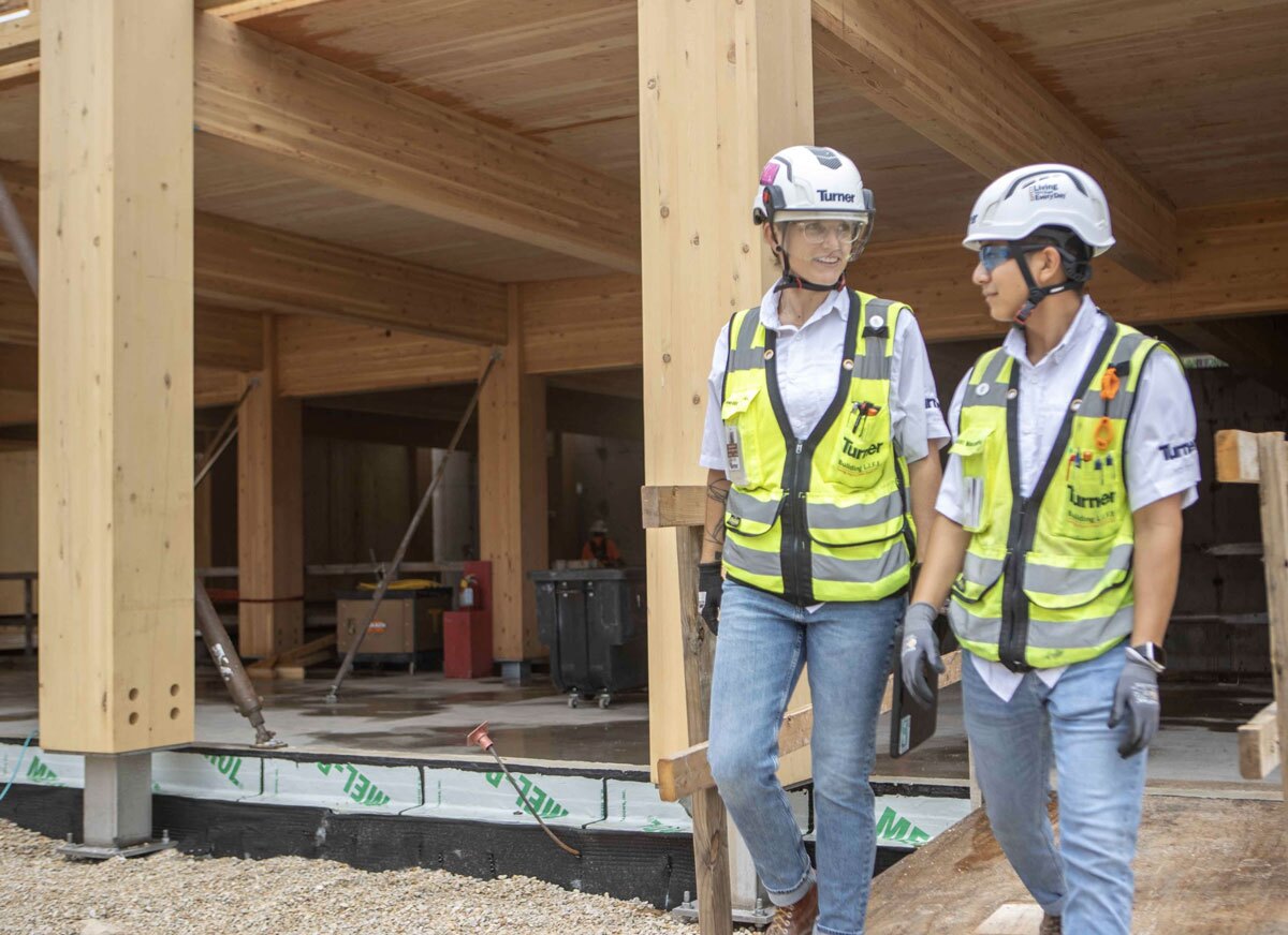 Two construction workers on a job site